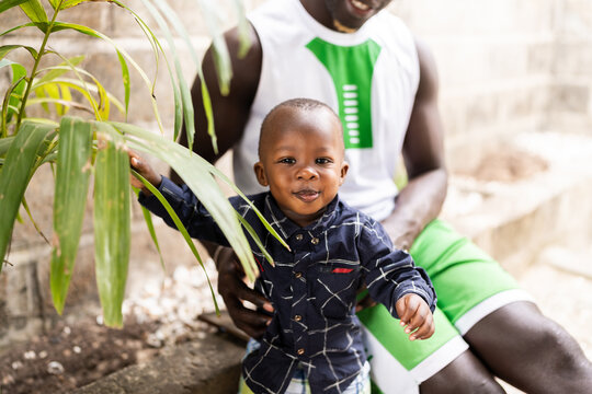 African father and son bonding with nature in Senegal
