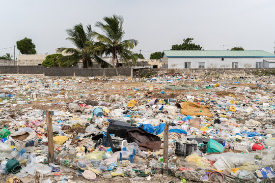 Urban landfill showing plastic waste and environmental pollution