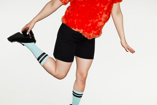 Person standing with heels and blue socks fashion style outfit