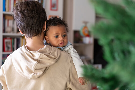 Curious Baby is looking Christmas Tree