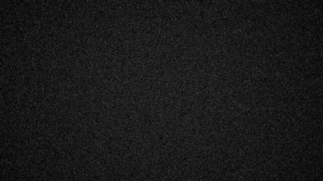 digital noise A close up of a white and gray noise with a grainy texture. The pattern of tints and shades create a contrast with the dark background, giving it a peach and carmine undertone. TV Interf
