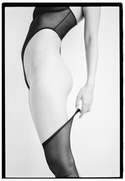 Close up photo of Fashionable Anonymous Woman in black lingerie