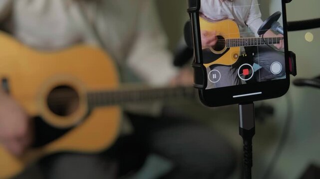 Home Musician Plays Intimate Acoustic Guitar. Indie Artist Singer Songwriter Shares Authentic Acoustic Music on Social Media. Guitarist Influencer Live Streaming And Inviting Live Performance Stream