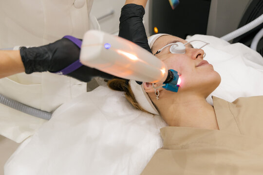 Modern laser facial treatment in professional beauty clinic
