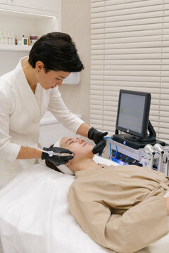 Professional facial injection procedure in modern beauty clinic