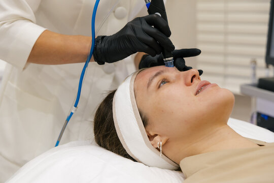 Professional facial skincare treatment with cosmetic device