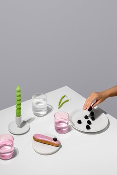 Minimalist dessert table with berries and drinks