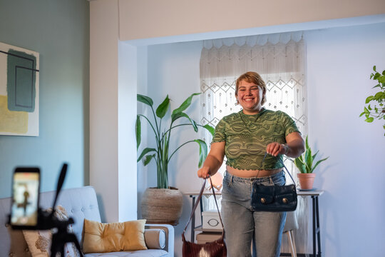 Woman posing in front of smartphone 