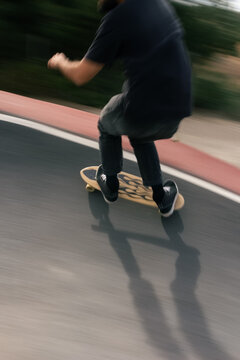 Skater Performs Tricks on Curved Ramp in Urban Skatepark