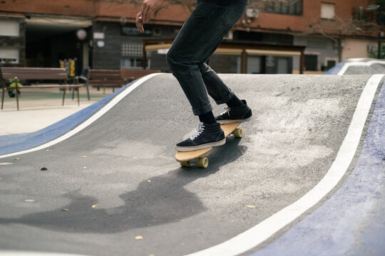 Skater Rides a Skateboard on Pump Track