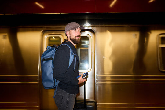 Man stands on the subway platform