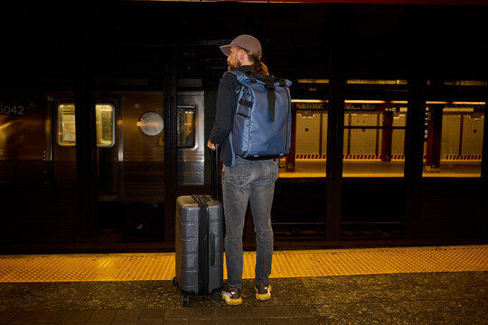 Man waits for an underground train.