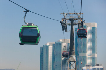 Busan Air Cruise, Busan cable car, ride on multicoloured sky capsule gondola route, with Songdo beach and Skywalk and Busan Bay panorama, South Korea, Songdo Station in a spring sunny day © tsuguliev