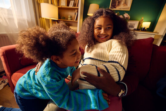Man relishes time with his daughters at home