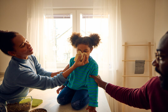 Parents look after their daughter.