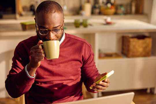 Man grabs a cup of tea while at home