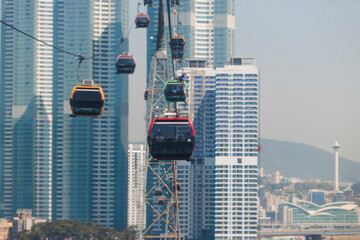 Busan Air Cruise, Busan cable car, ride on multicoloured sky capsule gondola route, with Songdo beach and Skywalk and Busan Bay panorama, South Korea, Songdo Station in a spring sunny day © tsuguliev