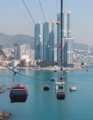 Busan Air Cruise, Busan cable car, ride on multicoloured sky capsule gondola route, with Songdo beach and Skywalk and Busan Bay panorama, South Korea, Songdo Station in a spring sunny day © tsuguliev