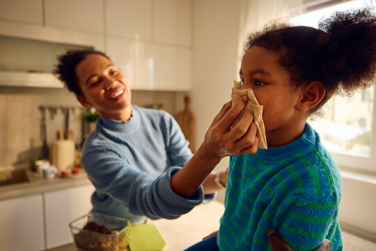 Mother takes care of her daughter