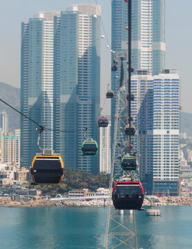 Busan Air Cruise, Busan cable car, ride on multicoloured sky capsule gondola route, with Songdo beach and Skywalk and Busan Bay panorama, South Korea, Songdo Station in a spring sunny day