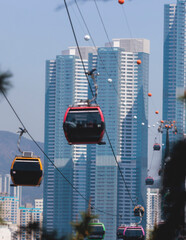 Busan Air Cruise, Busan cable car, ride on multicoloured sky capsule gondola route, with Songdo beach and Skywalk and Busan Bay panorama, South Korea, Songdo Station in a spring sunny day © tsuguliev