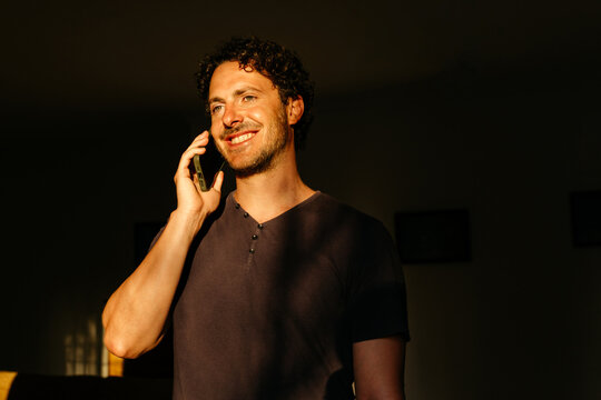 Man smiling talking on phone d