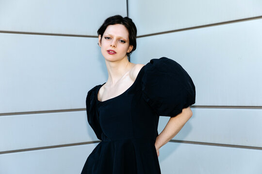 Woman wearing black puff sleeve dress