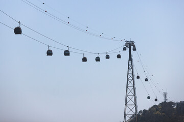 Busan Air Cruise, Busan cable car, ride on multicoloured sky capsule gondola route, with Songdo beach and Skywalk and Busan Bay panorama, South Korea, Songdo Station in a spring sunny day © tsuguliev