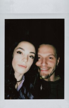 A Polaroid selfie of a beautiful couple in love