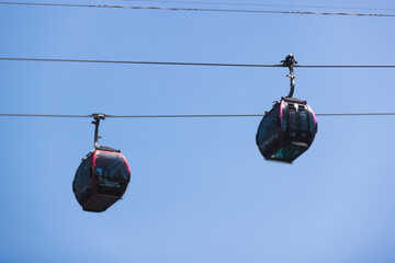 Busan Air Cruise, Busan cable car, ride on multicoloured sky capsule gondola route, with Songdo beach and Skywalk and Busan Bay panorama, South Korea, Songdo Station in a spring sunny day © tsuguliev