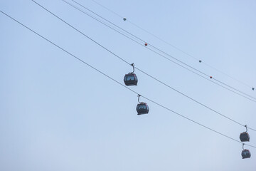 Busan Air Cruise, Busan cable car, ride on multicoloured sky capsule gondola route, with Songdo beach and Skywalk and Busan Bay panorama, South Korea, Songdo Station in a spring sunny day © tsuguliev
