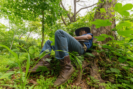 Cowboy Boots Close Up Resting In Forest