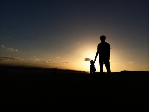 Father and Child at Sunset