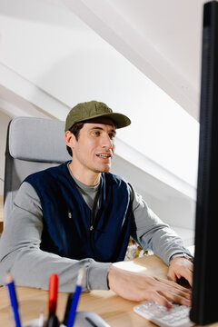 Freelance man at a home workspace completing remote tasks