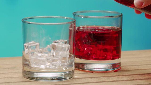 Vermouth Negroni, spanish wine drink, Alcoholic Americano Cocktail bitter, sweet vermouth and soda water, close up of making drink, summer spanish vacations. 