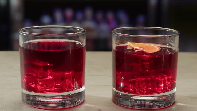 Vermouth Negroni, spanish wine drink, Alcoholic Americano Cocktail bitter, sweet vermouth and soda water, close up of making drink, summer spanish vacations. 