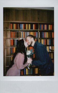 A Polaroid wedding photo of the newlyweds kissing. ugc