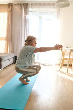 Senior Woman Practicing Balance Squat Yoga at Home