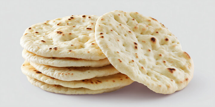Freshly baked pita bread stacked on a white background  