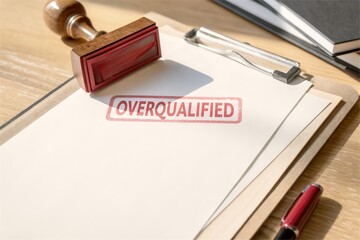 Overqualified stamp on resume document. Employment rejection and career issue