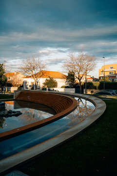 Park With Water Feature and Tree Reflections in the Evening Light