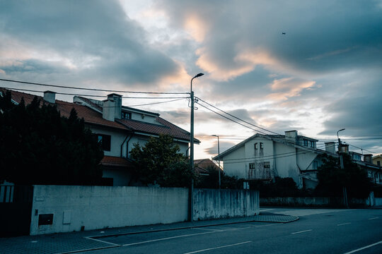 Cloudy Sky Over Houses in a Quiet Neighborhood During Evening