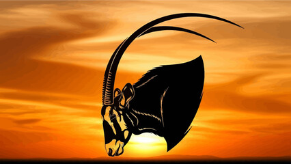 Oryx Silhouette Against Dramatic Sunset Sky in African Savannah