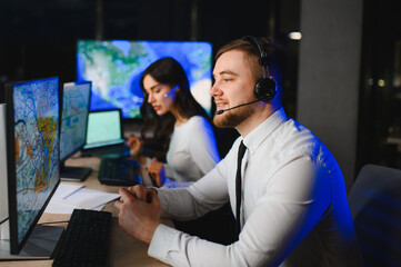 Dispatchers working in a modern operations center