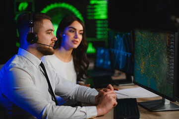 Air traffic controllers managing flight operations at modern control center