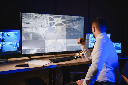 Security guard monitoring cctv surveillance system