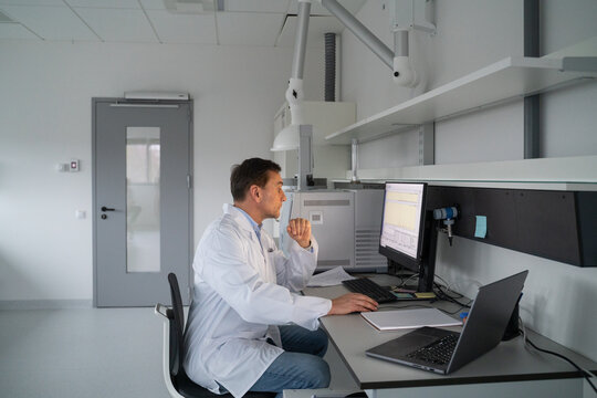 Scientist Using Computer in Laboratory 