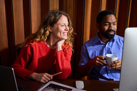 Colleagues sharing smiles at the office