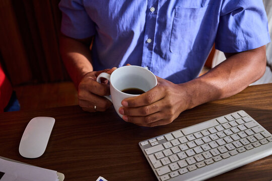 Anonymous businessman sitting at his desk