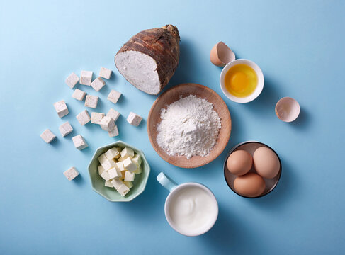 Ingredients and tools for making a butter roll cake are on table
